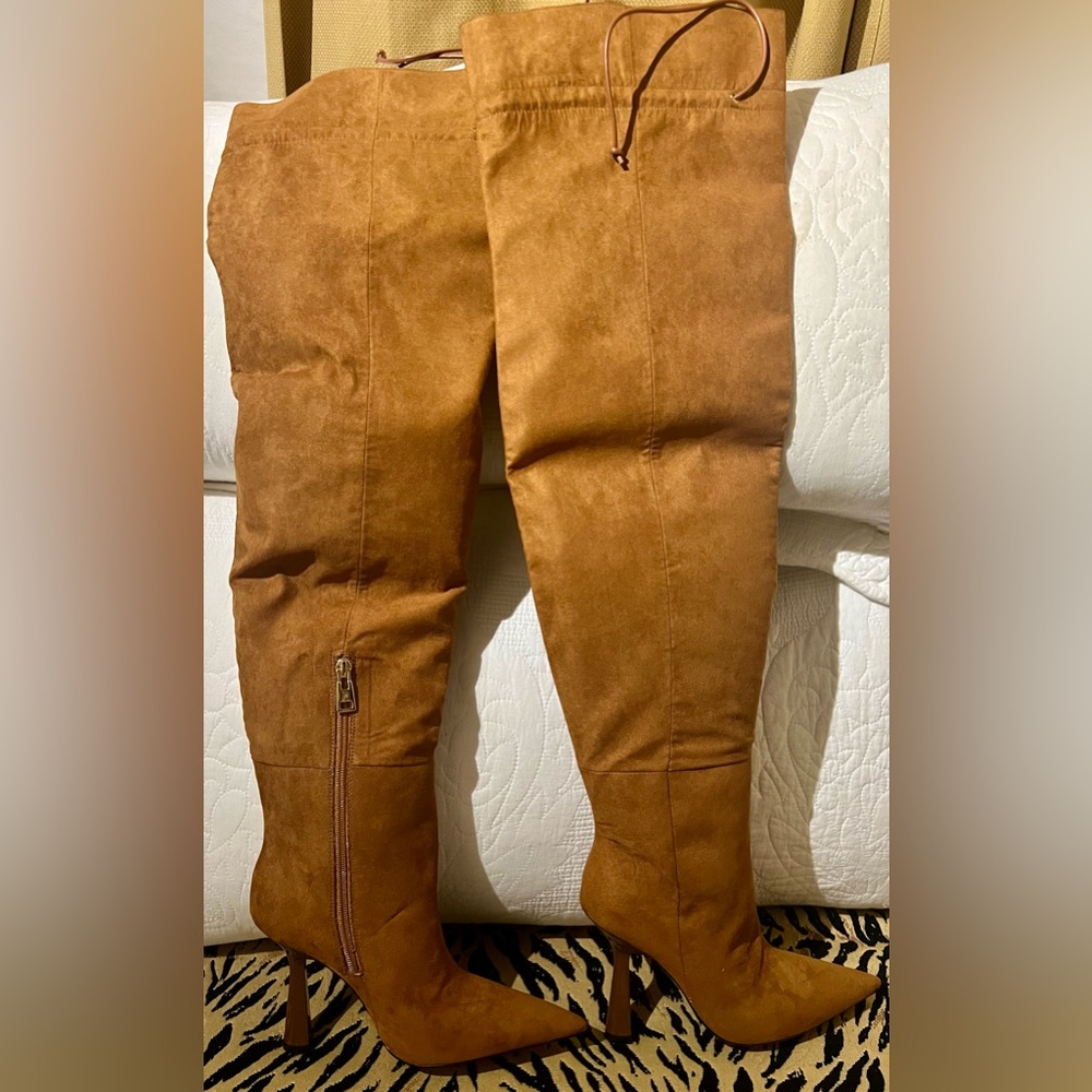 Good American tobacco colored over the knee boots with gold zipper.